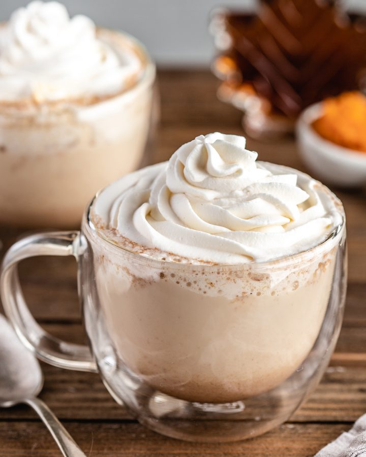 Pumpkin Spice Latte in a glass mug with whipped cream