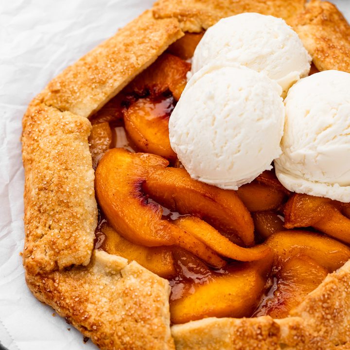 a Peach Galette with 3 scoops of vanilla ice cream on top