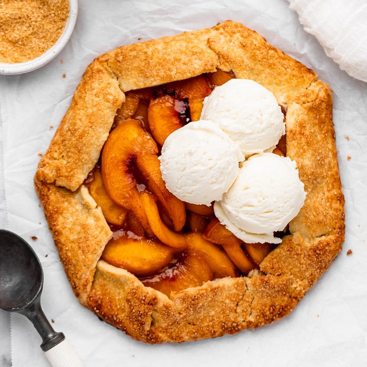 a Peach Galette with 3 scoops of vanilla ice cream on top