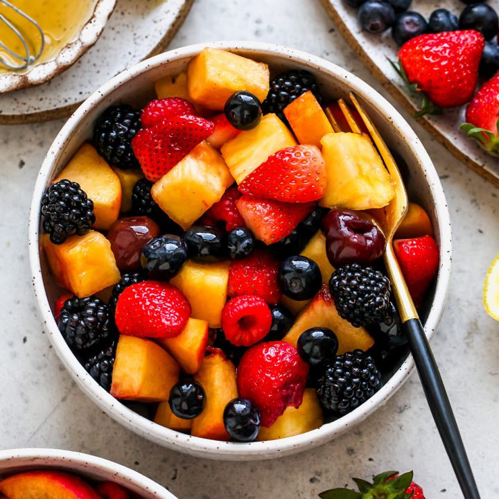 summer Fruit Salad in a bowl with a fork