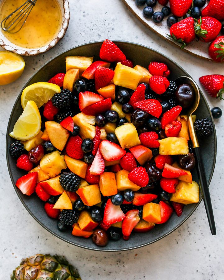 Fruit Salad Recipe in a serving bowl with a spoon