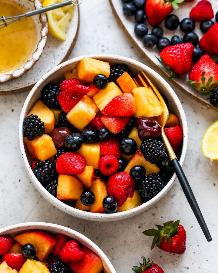 overhead view of a bowl of Summer Fruit Salad with a fork