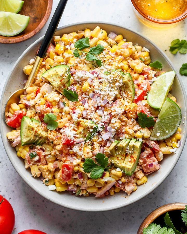 Mexican Corn Salad in a serving bowl with a spoon