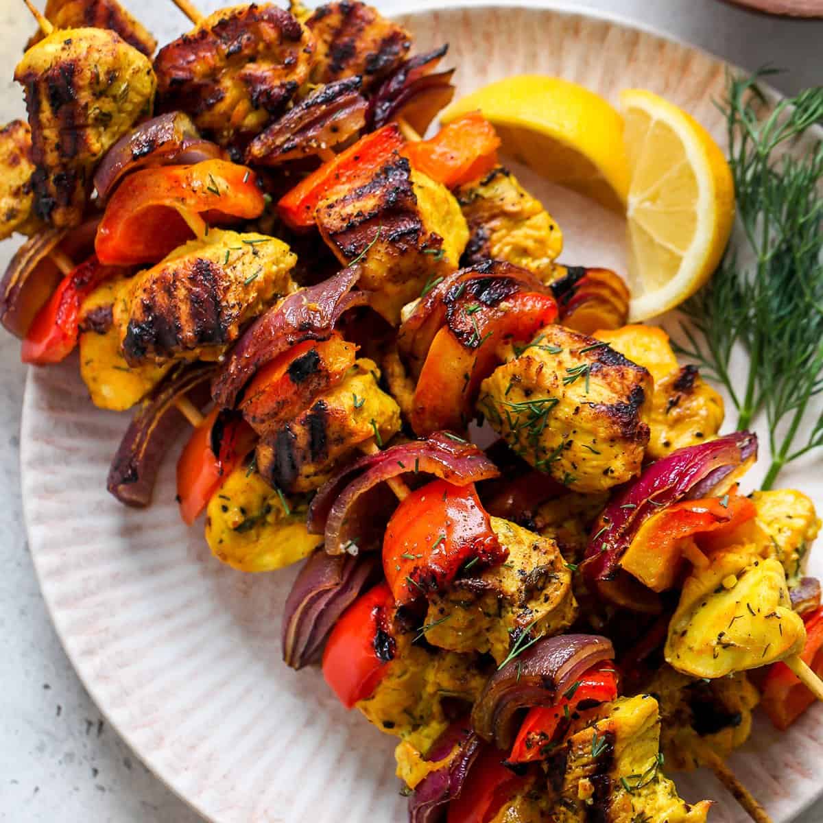 4 chicken kabobs on a plate