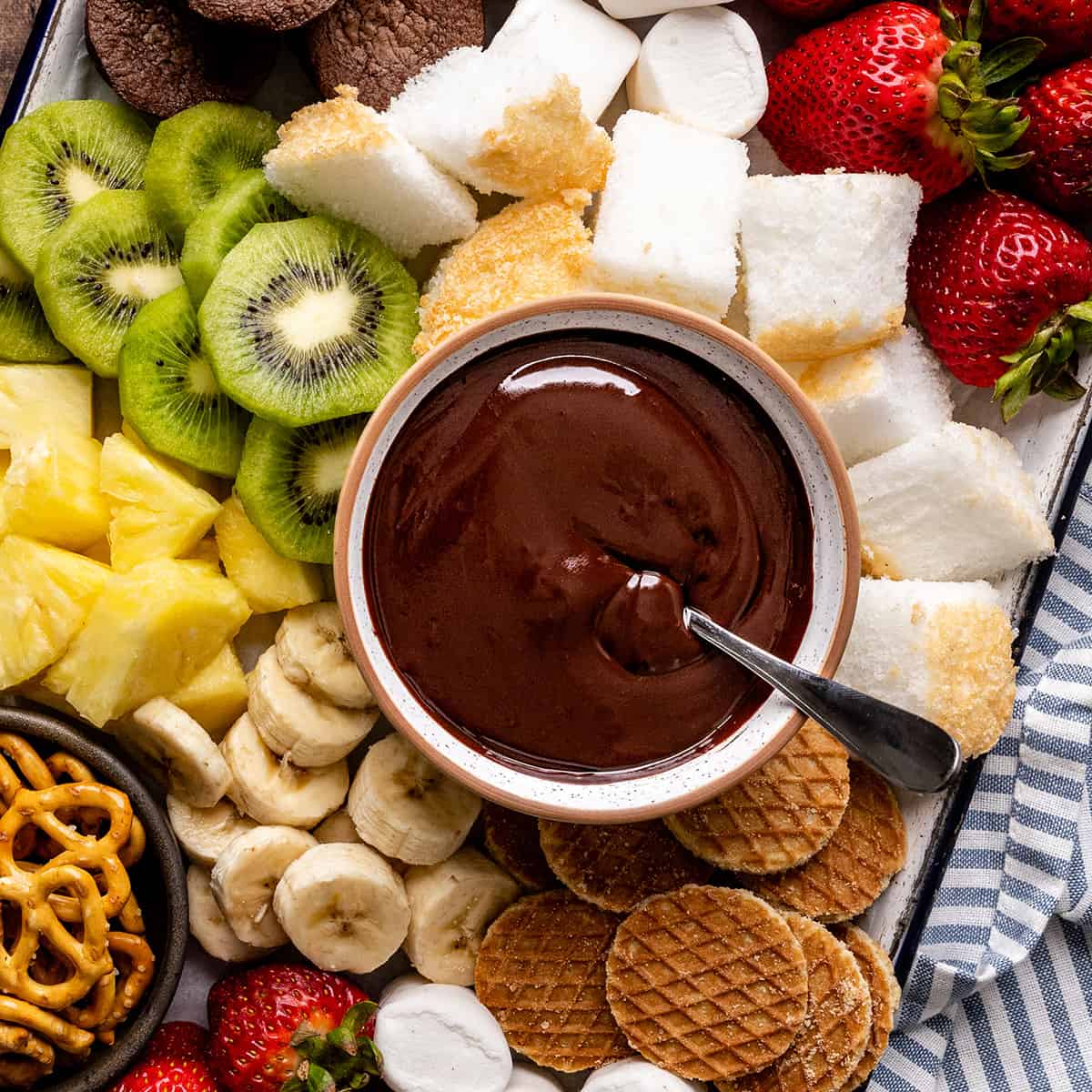 overhead view of a bowl of Chocolate Fondue surrounded by chocolate fondue dippers 