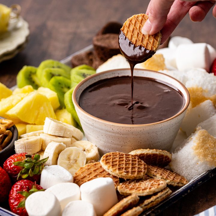 a cookie being dipped into Chocolate Fondue