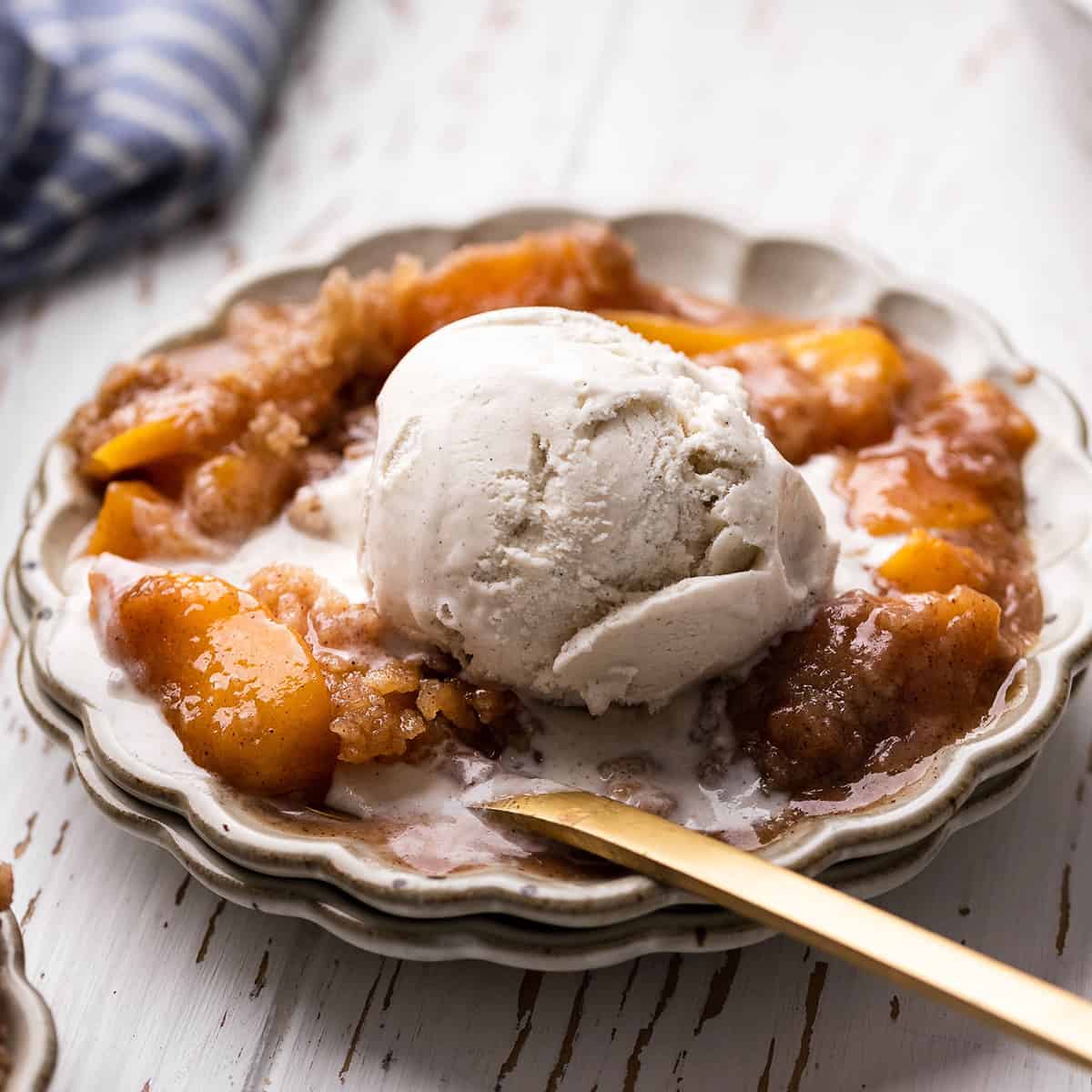 Peach Crumble Recipe on a plate with ice cream