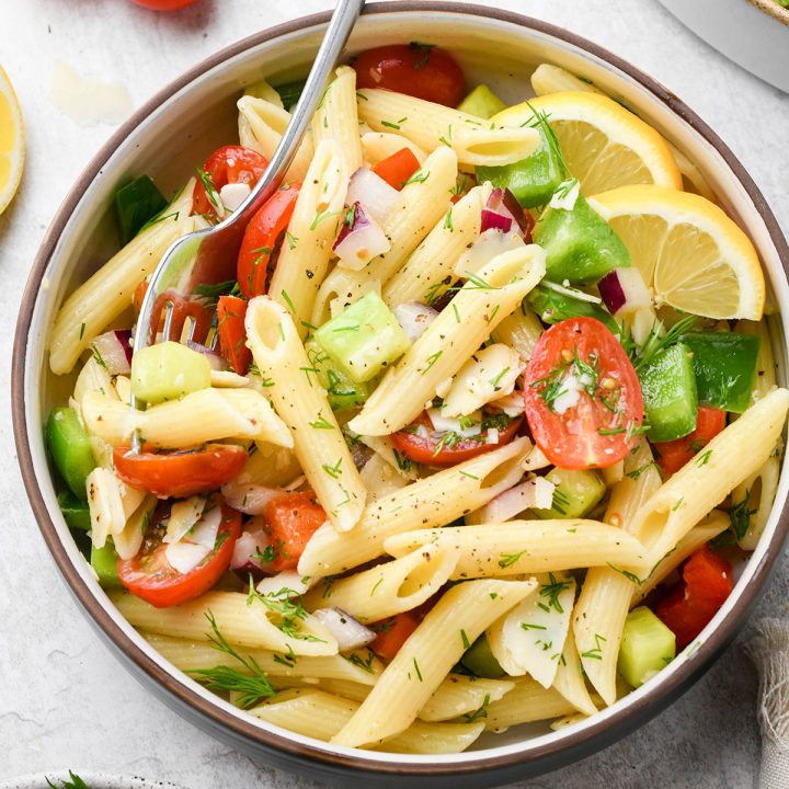 a small bowl of lemon pasta salad with a fork