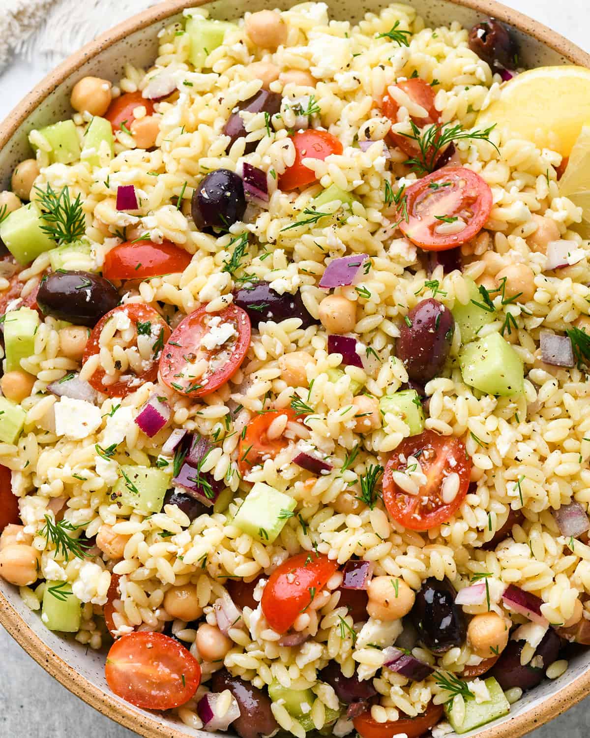 mediterranean orzo salad in a serving bowl