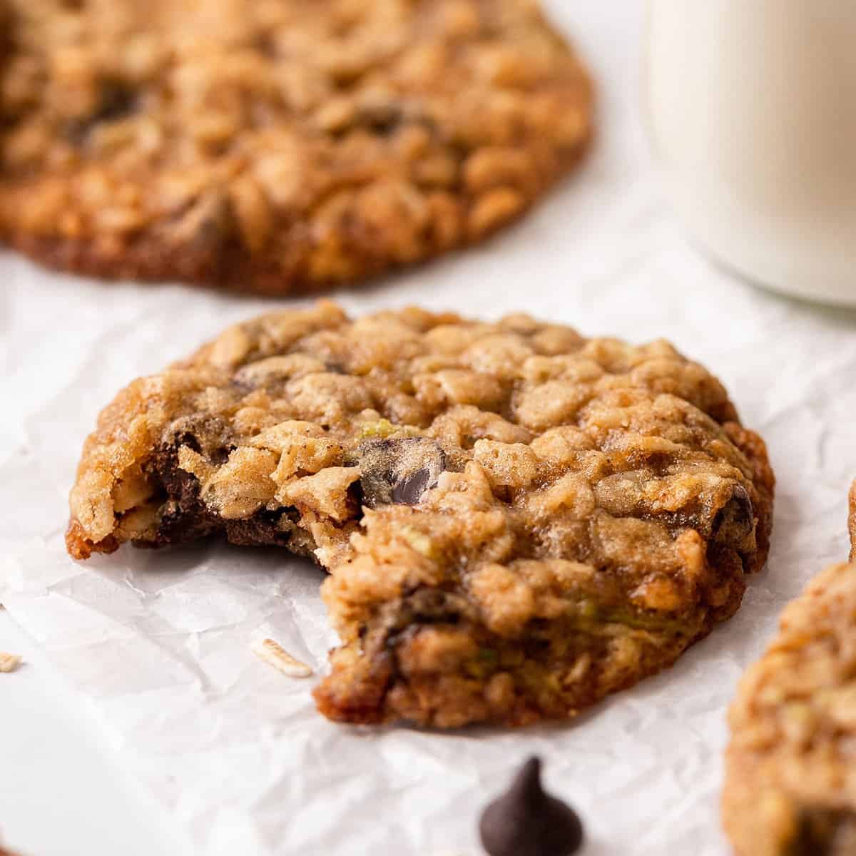 2 Oatmeal Zucchini Cookies - one has a bite taken out of it. 
