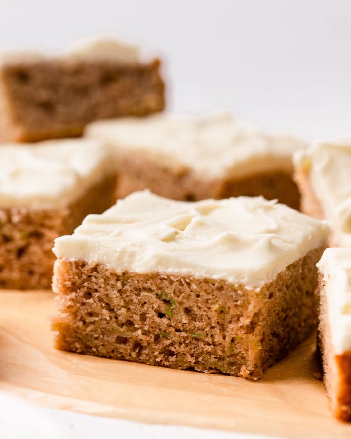 up close photo of a zucchini bar with cream cheese frosting