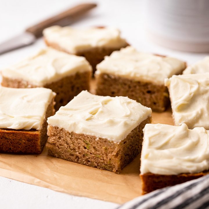 7 Zucchini Bars with cream cheese frosting cut into square
