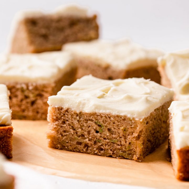 6 Zucchini Bars with cream cheese frosting cut into squares 