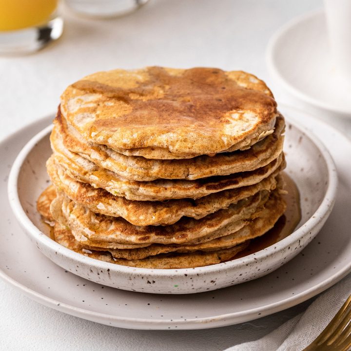 a stack of 7 Zucchini Pancakes with syrup 