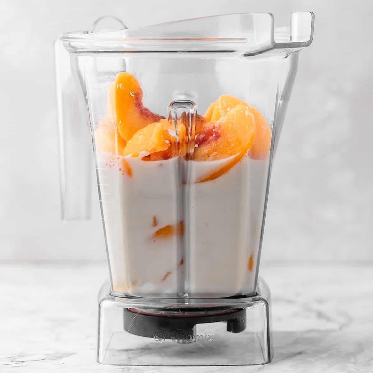 the ingredients in this Peach Smoothie Recipe in a blending container before blending