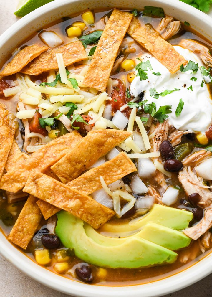 Chicken Tortilla Soup in a bowl with toppings