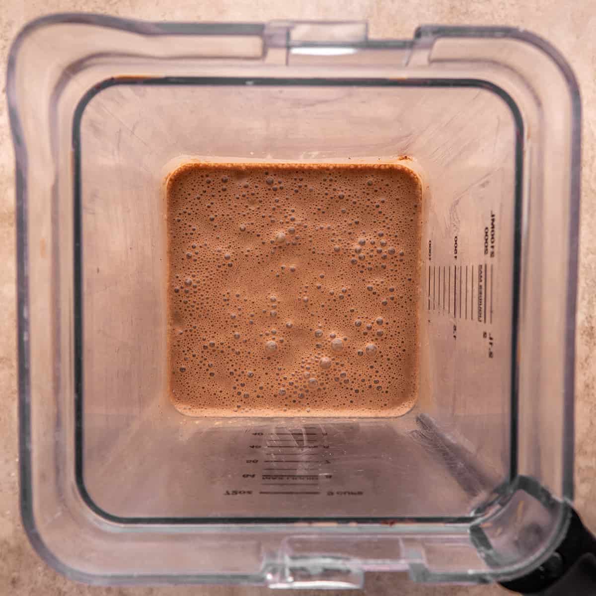 Chocolate crepe batter in a blender after blending