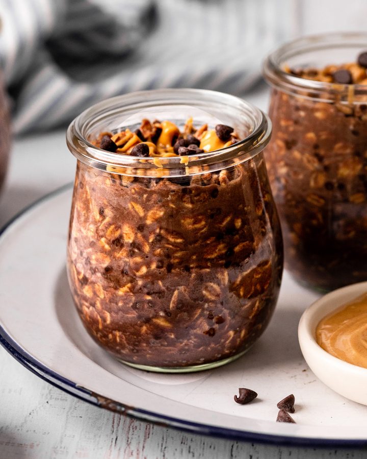 a glass jar of Chocolate Peanut Butter Overnight Oats