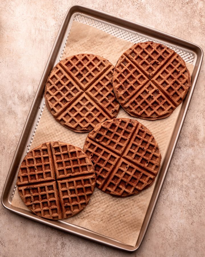 chocolate waffles on a baking sheet to be kept warm