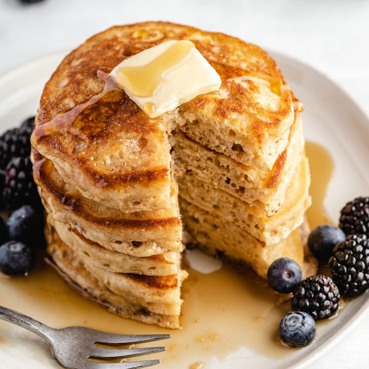 stack of 5 pancakes with a bite cut out of it