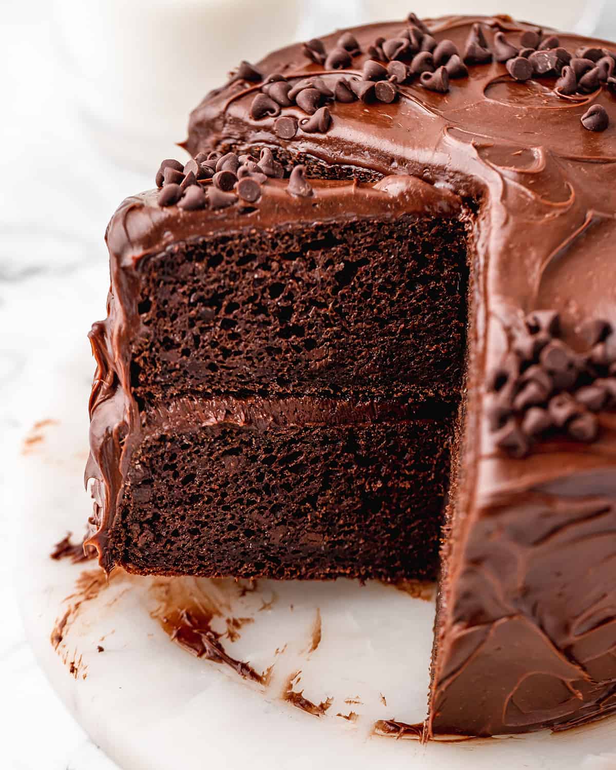Healthy Chocolate Cake with a slice cut out of it