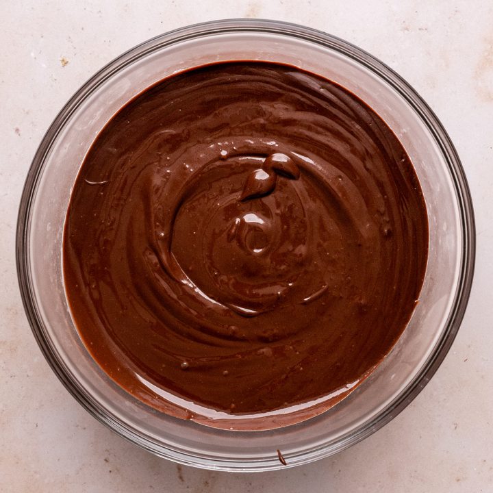 chocolate pudding stored in a glass bowl to chill