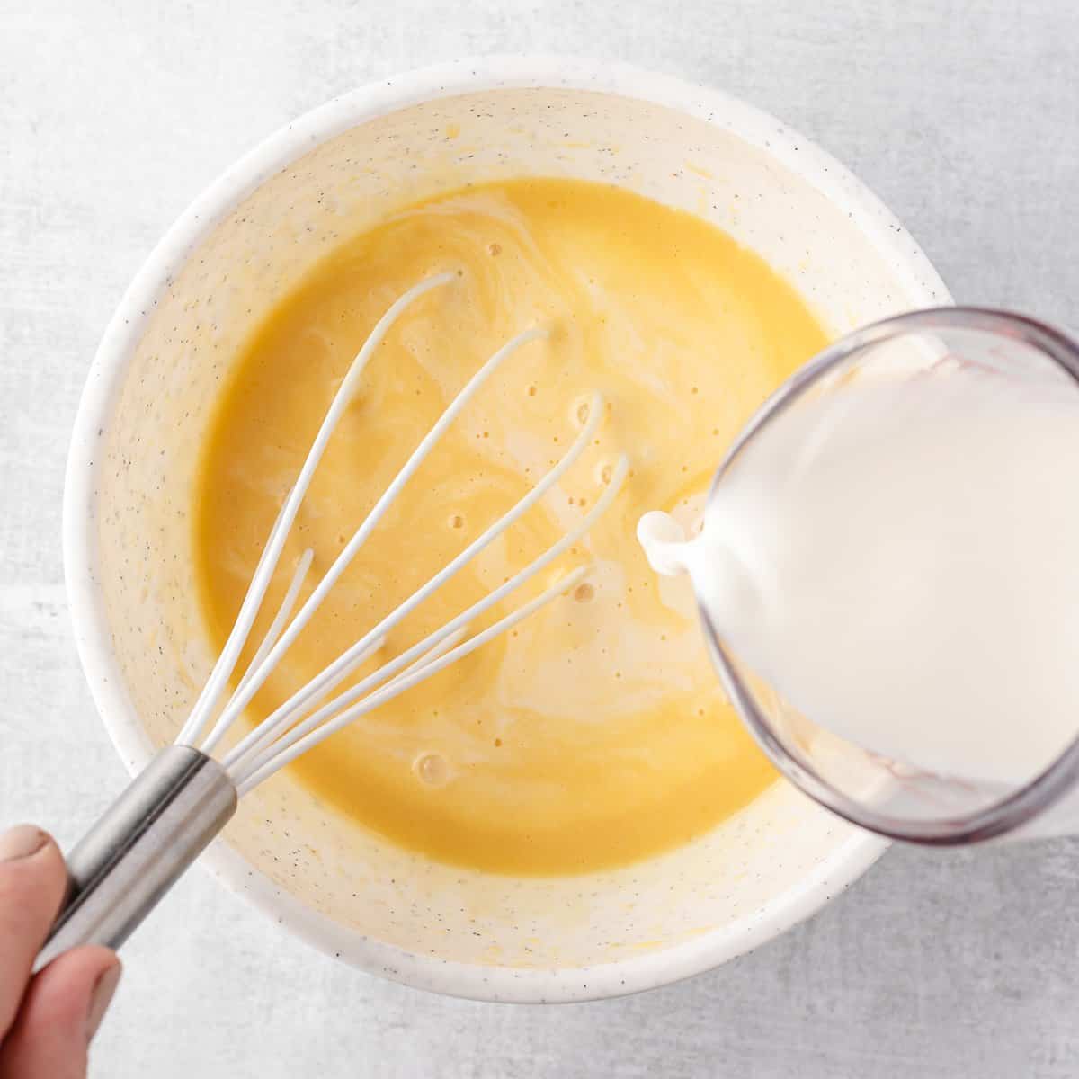 How to Make Pancakes from Scratch - whisking in milk
