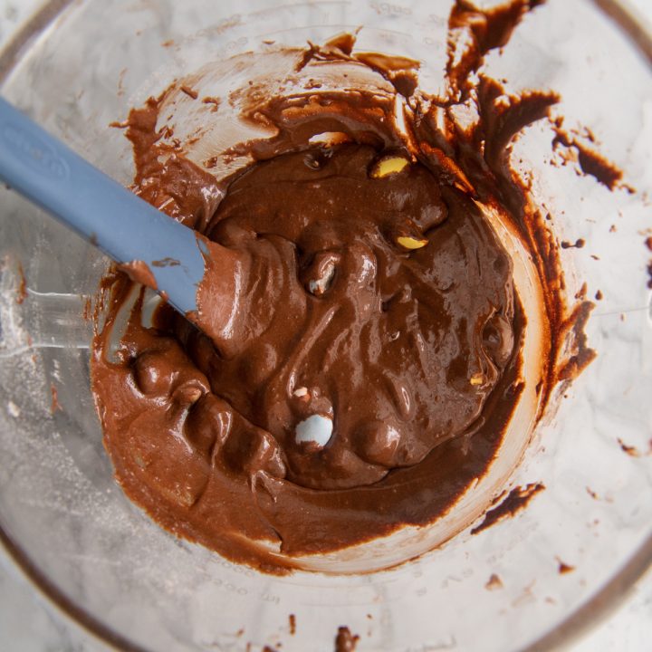 mini egg brownie batter in a bowl with a spatula