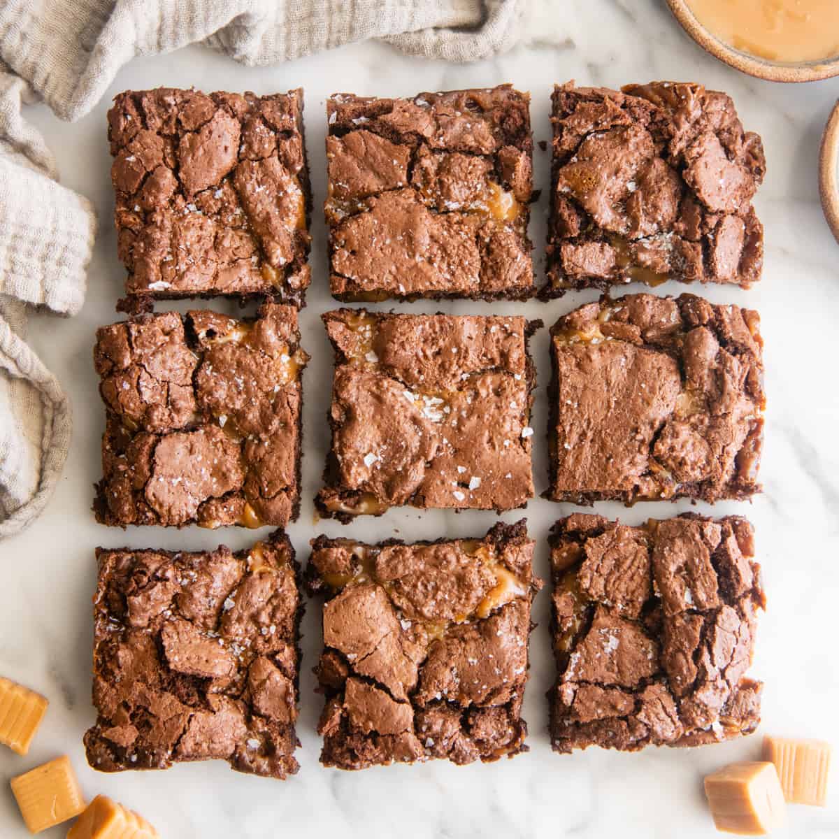 a batch of Salted Caramel Brownies cut into 9 squares 