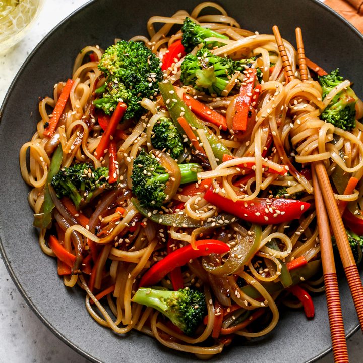 Vegetable Lo Mein in a black bowl with chopsticks