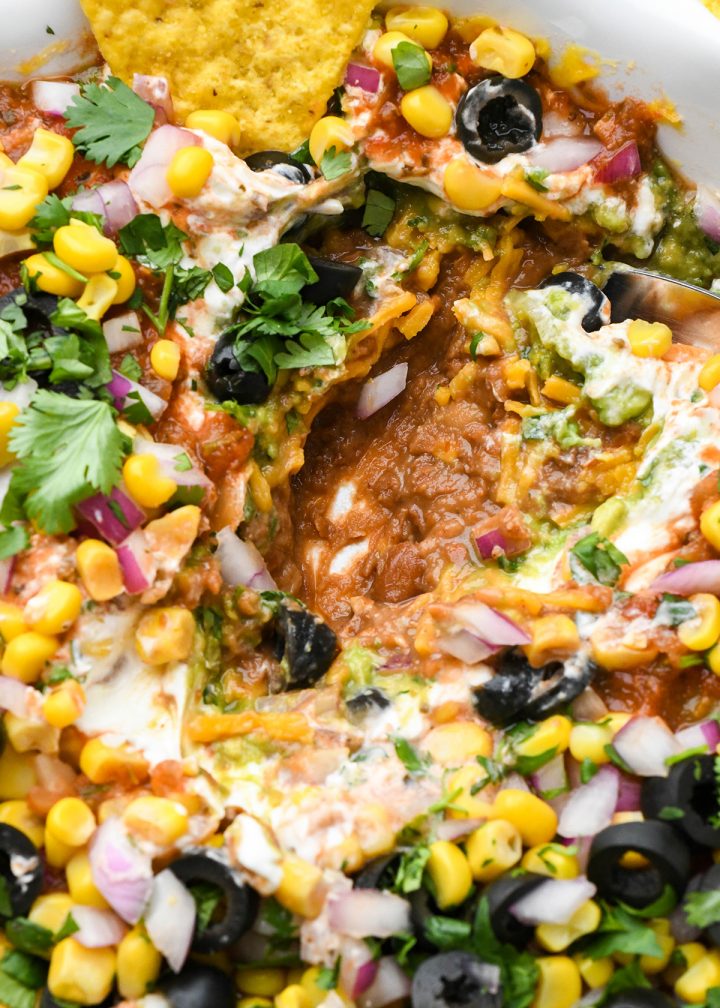 up close photo of Mexican 7 Layer Dip in a serving dish