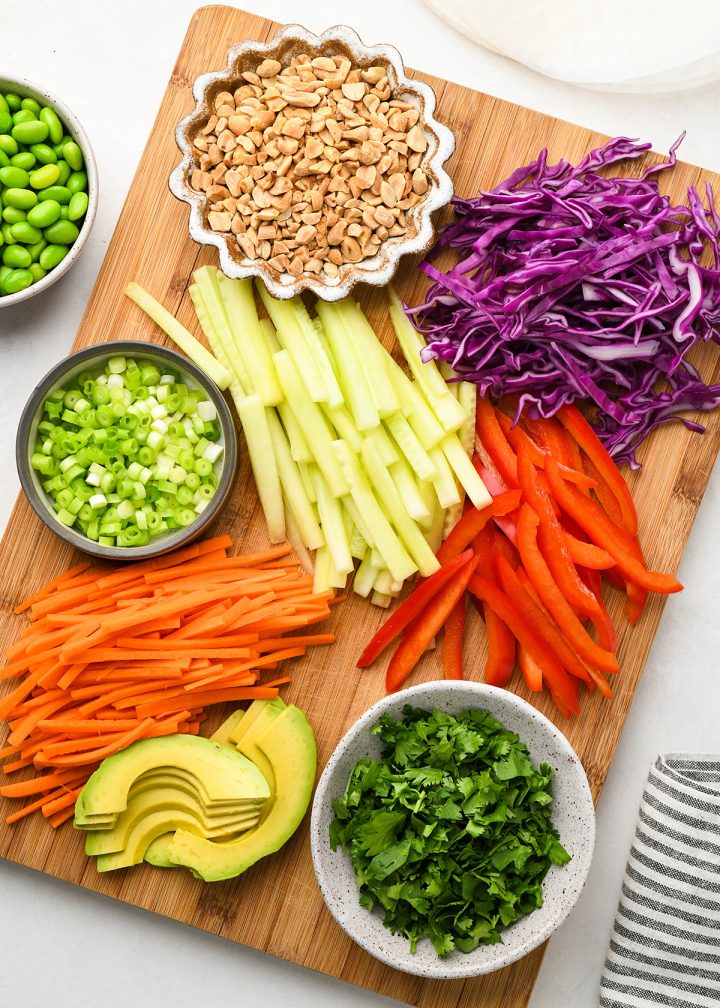 overhead view of the ingredients in this spring roll recipe laid out on a cutting board ready to use
