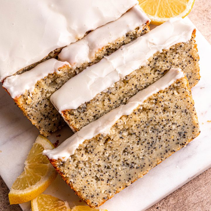 Lemon Poppy Seed Bread with 3 slices cut out of it