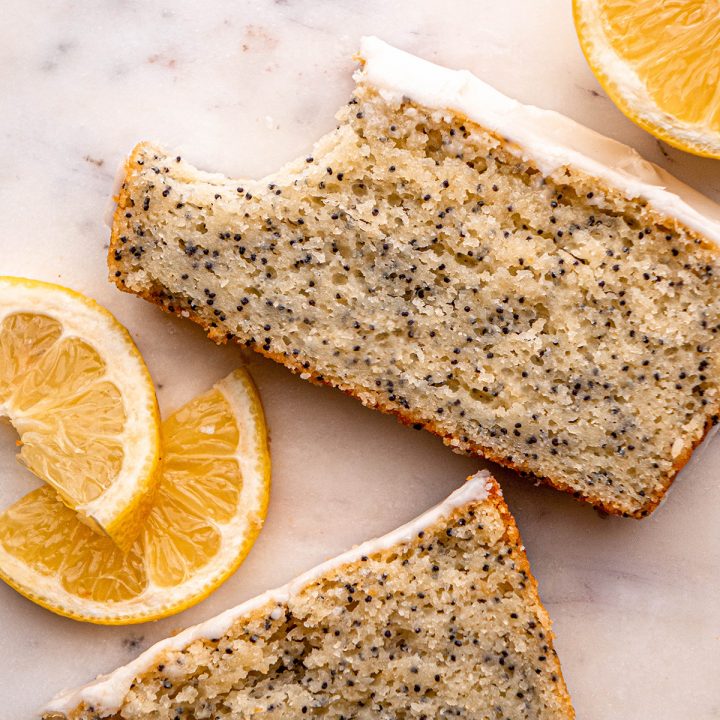 a slice of Lemon Poppy Seed Bread with a bite taken out of it