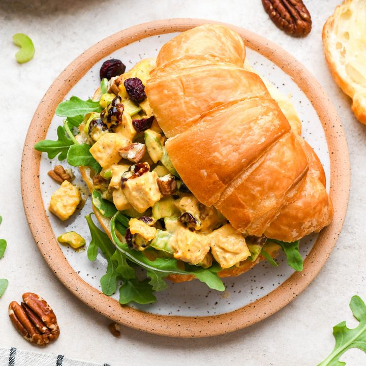 Cranberry Chicken Salad sandwich on a croissant on a plate
