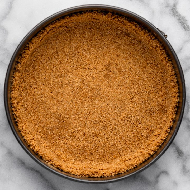 a partially baked graham cracker crust before filling