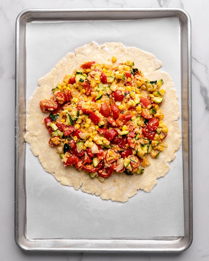 savory galette filling on top of galette dough
