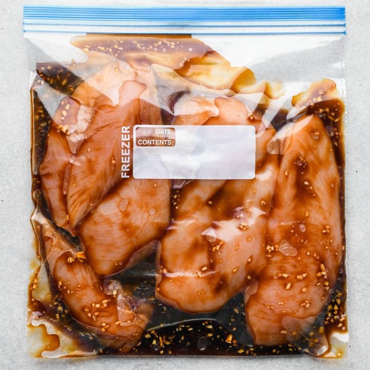 chicken breasts marinating in a plastic bag