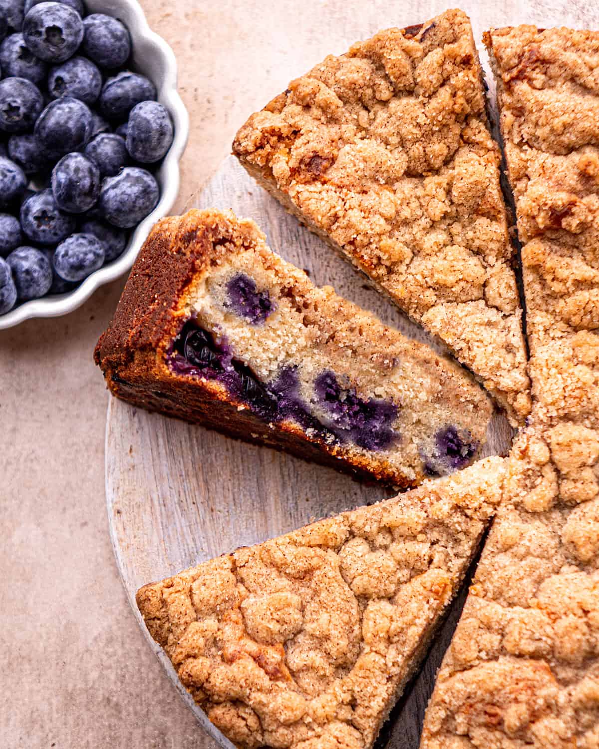 Blueberry Coffee Cake with 3 slices cut out of it