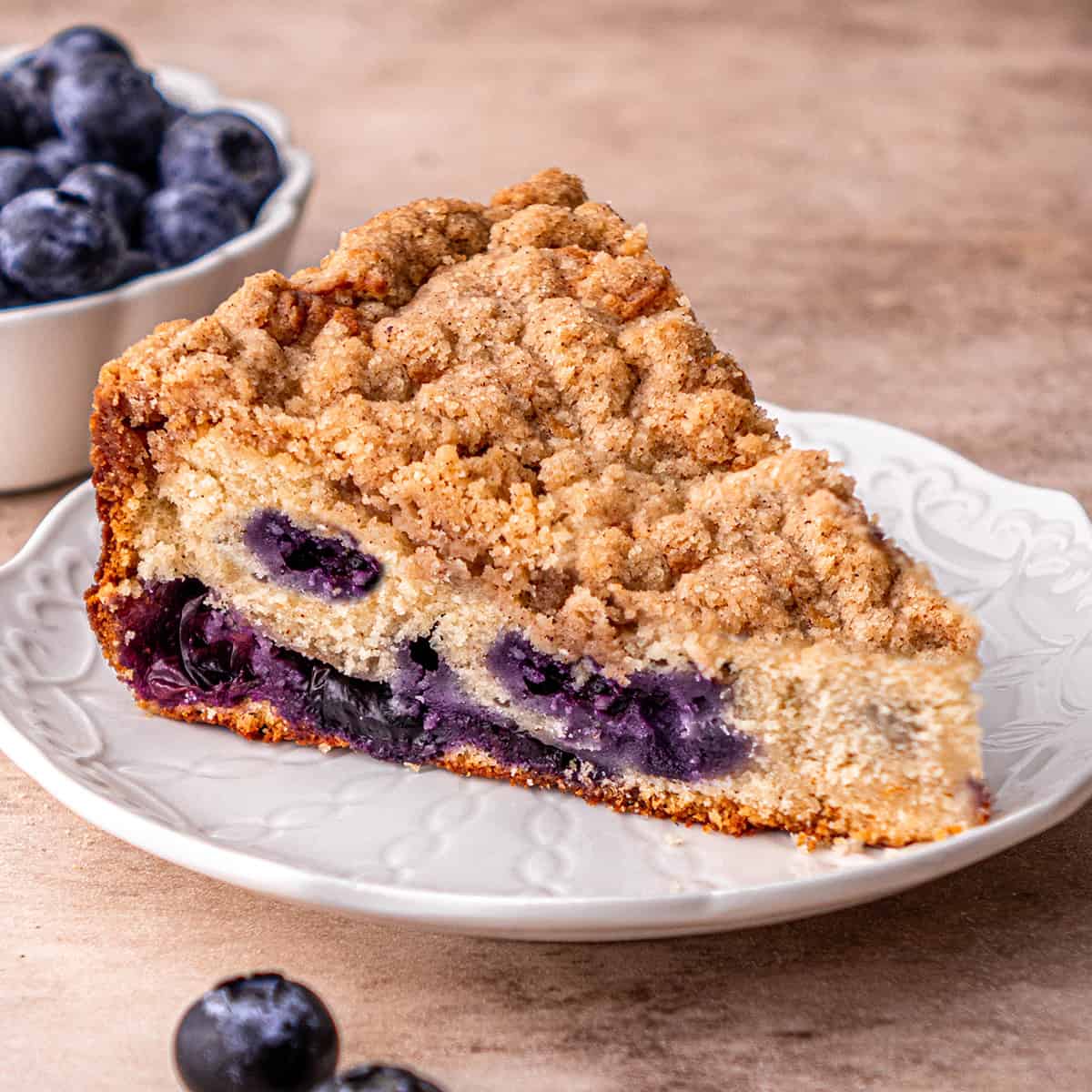a slice of Blueberry Coffee Cake on a plate