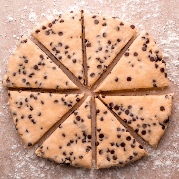chocolate chip scone dough cut into 8 triangles