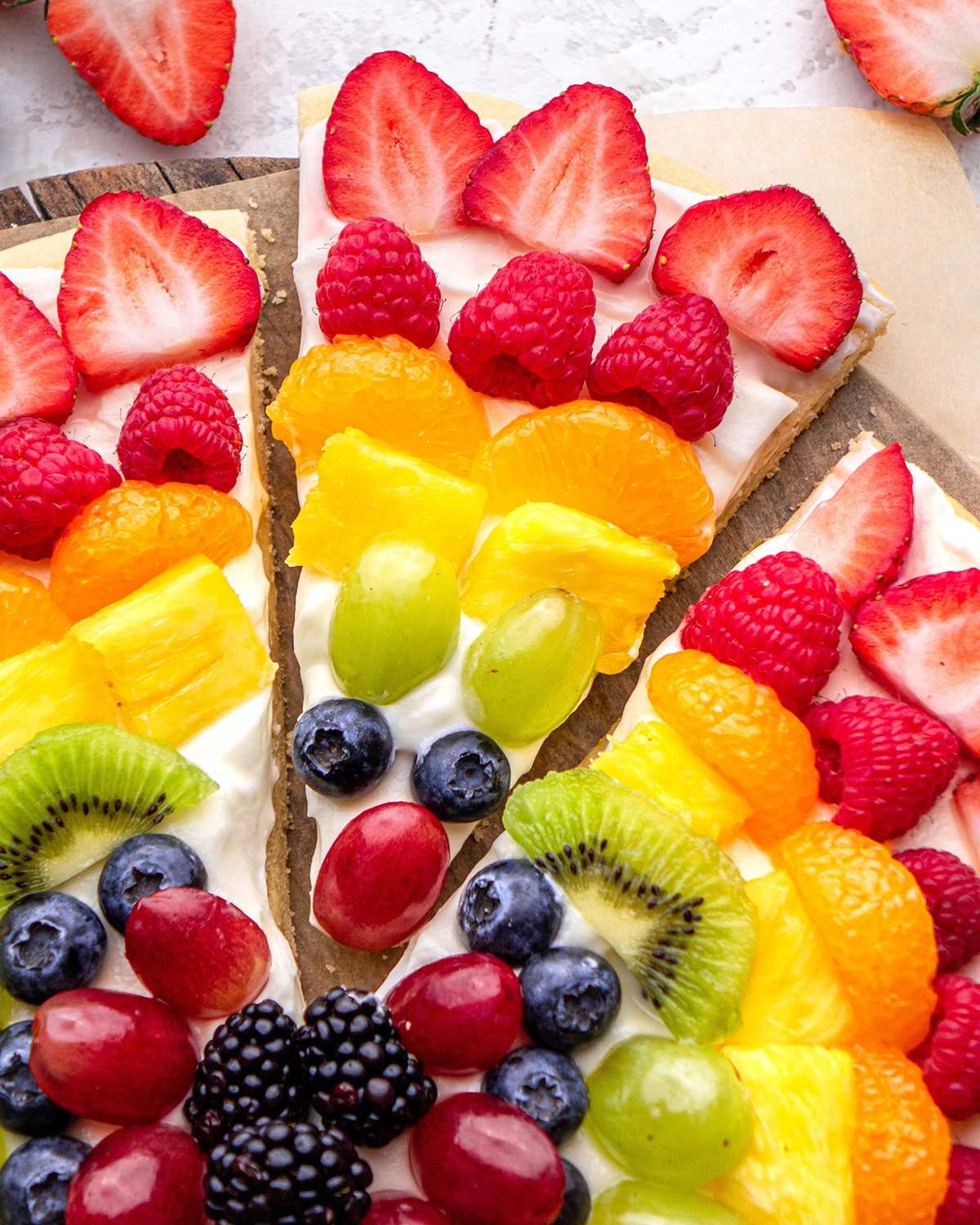 up close photo of a slice of Fruit Pizza on a serving plate