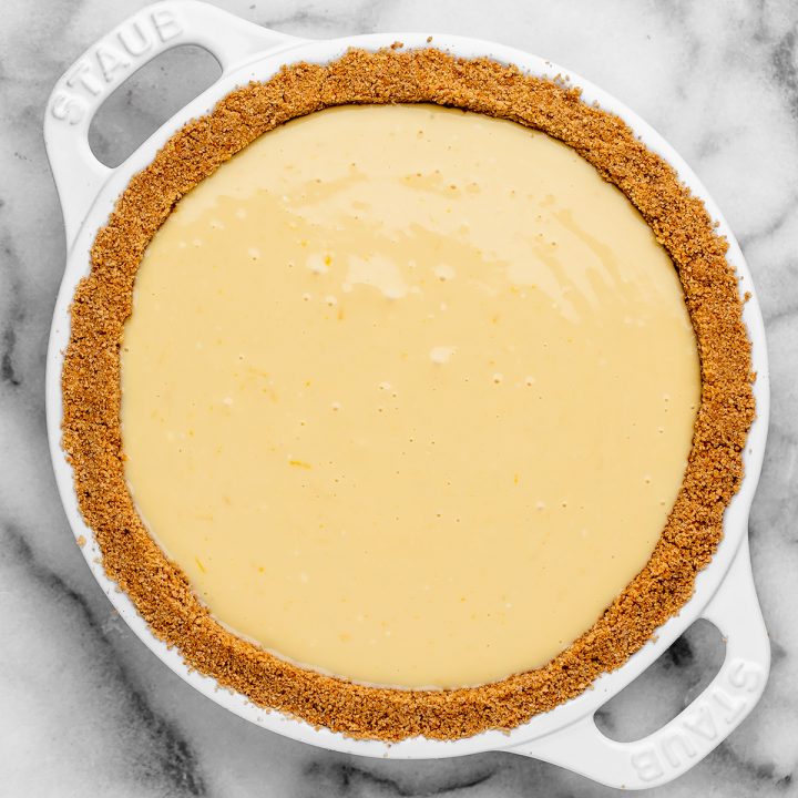 graham cracker crust filled with pie filling before baking