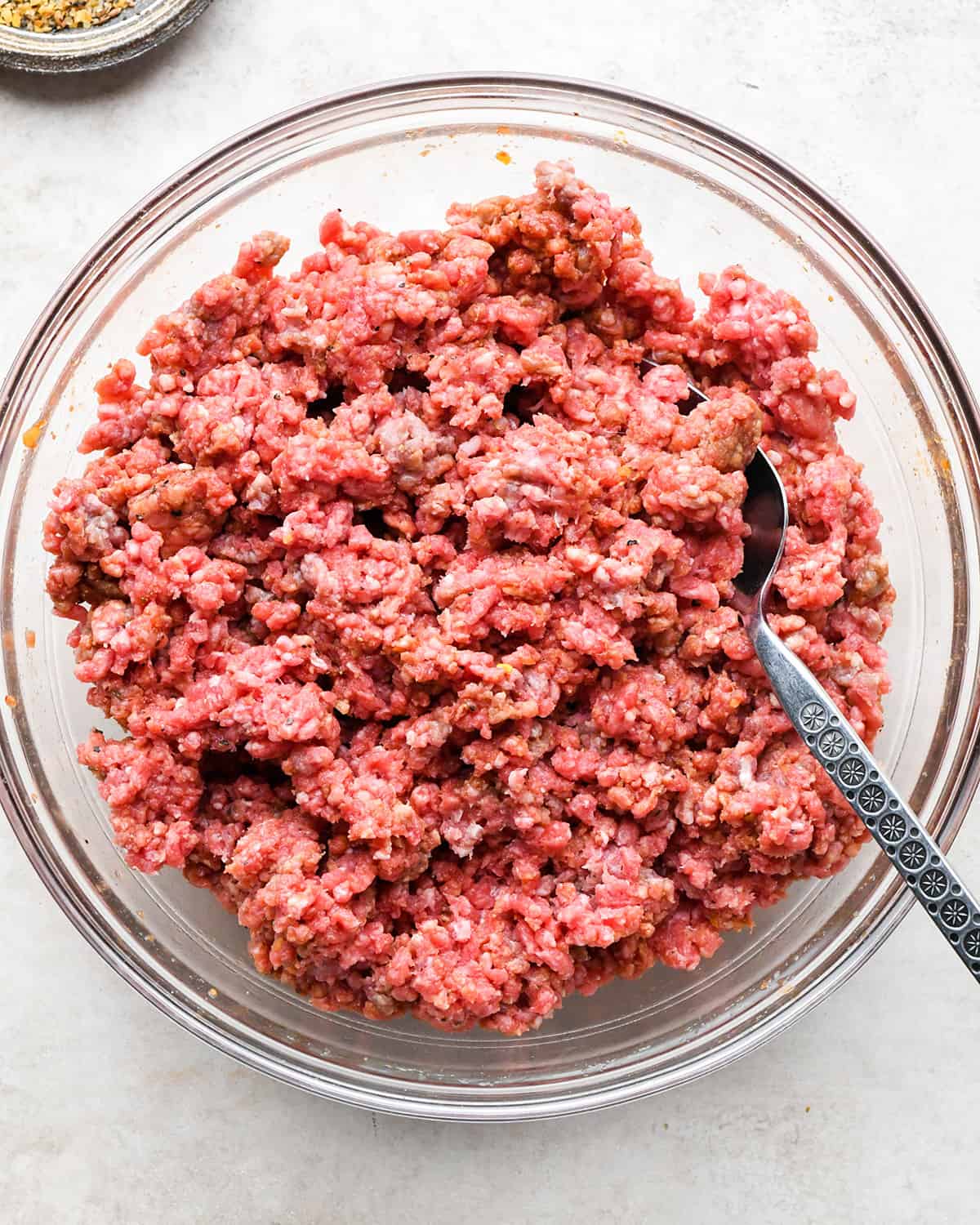 a  photo showing How to Make Hamburger Patties - ingredients combined in a bowl