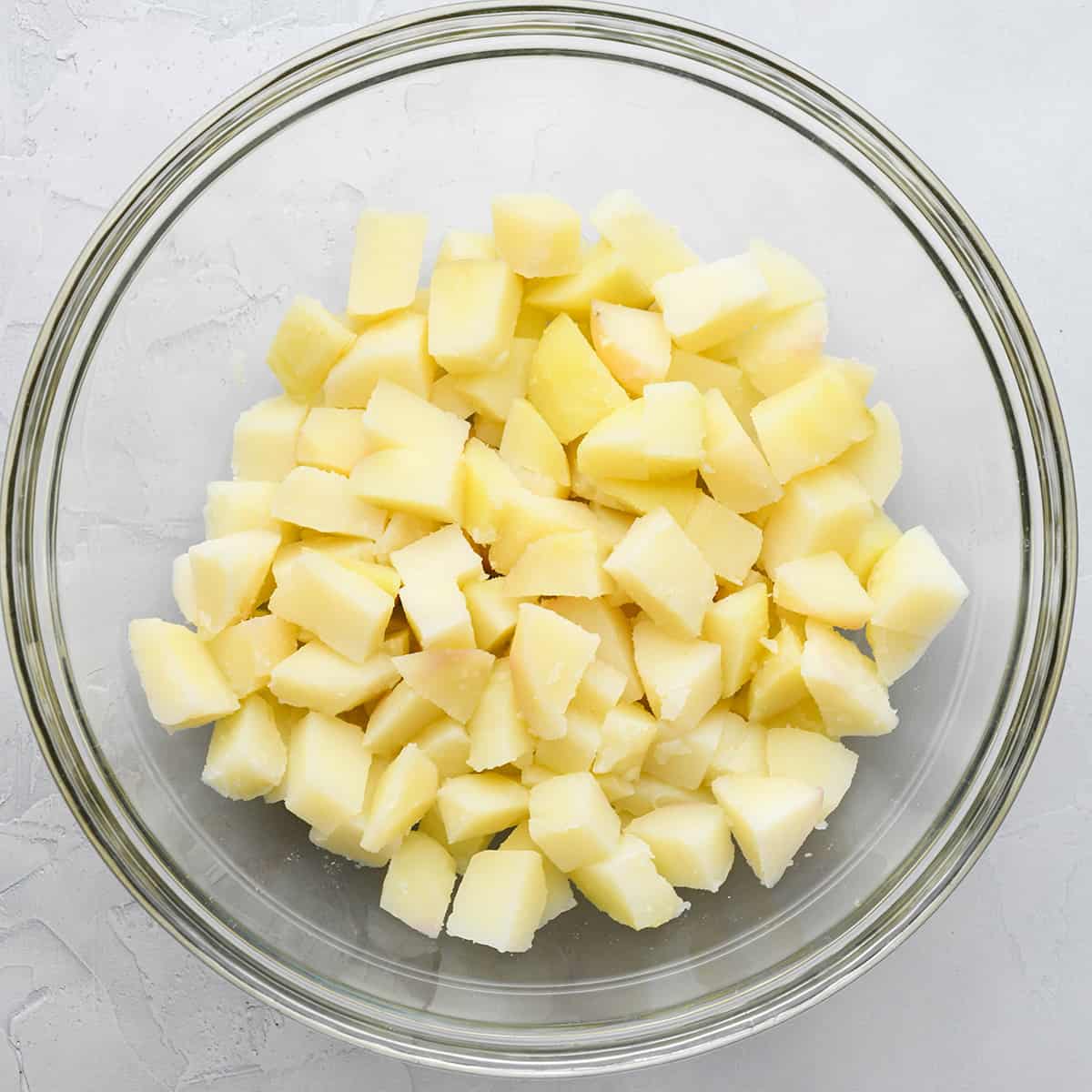 diced potatoes in a large bowl to make potato salad 