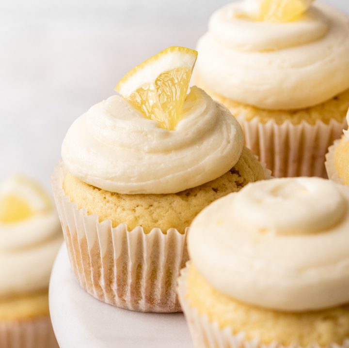 lemon frosting on top of 3 cupcakes