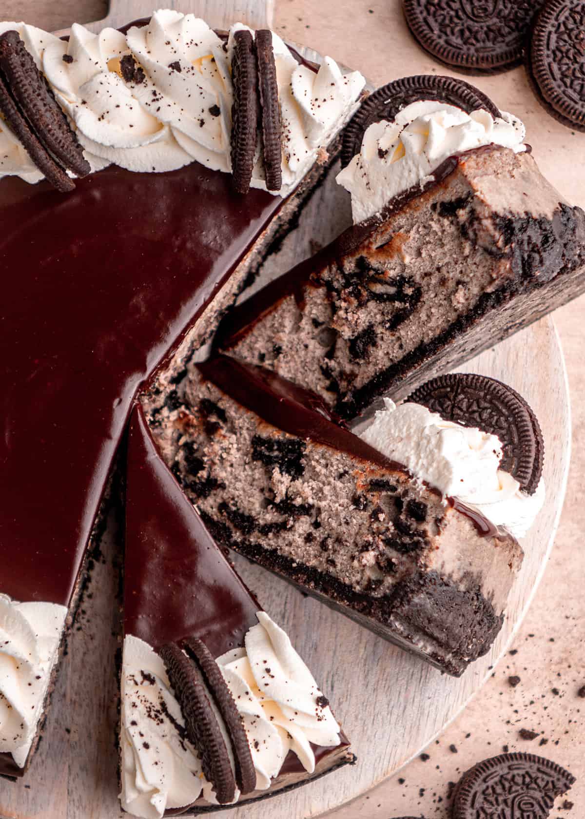 Oreo Cheesecake with 3 slices cut out of it