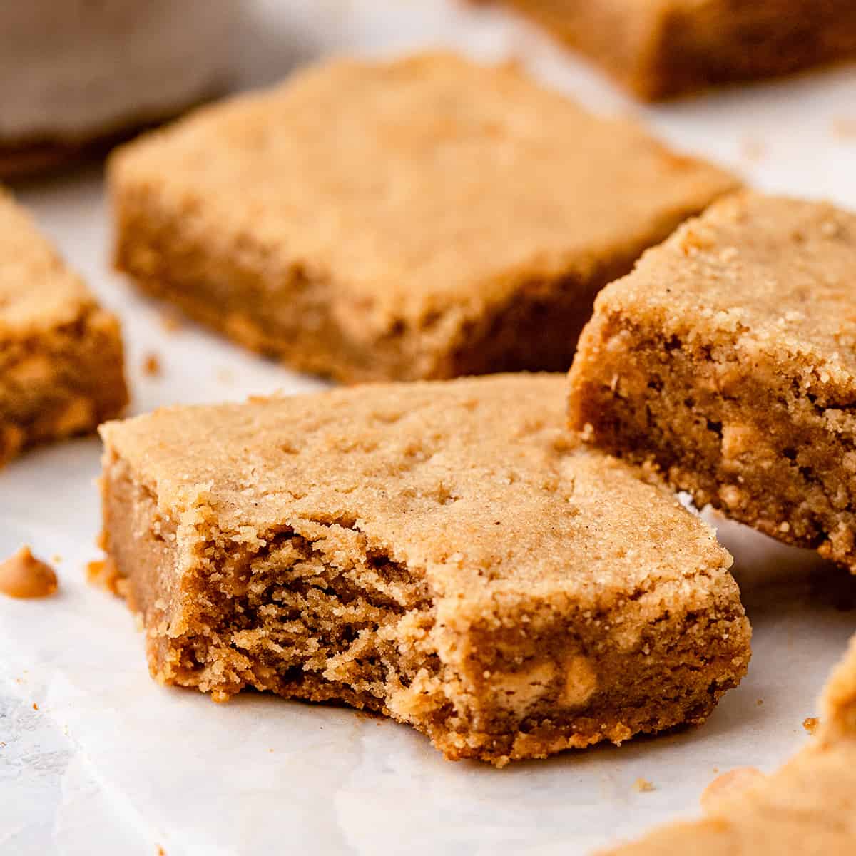 3 Peanut Butter Cookie Bars, one with a bite taken out of it