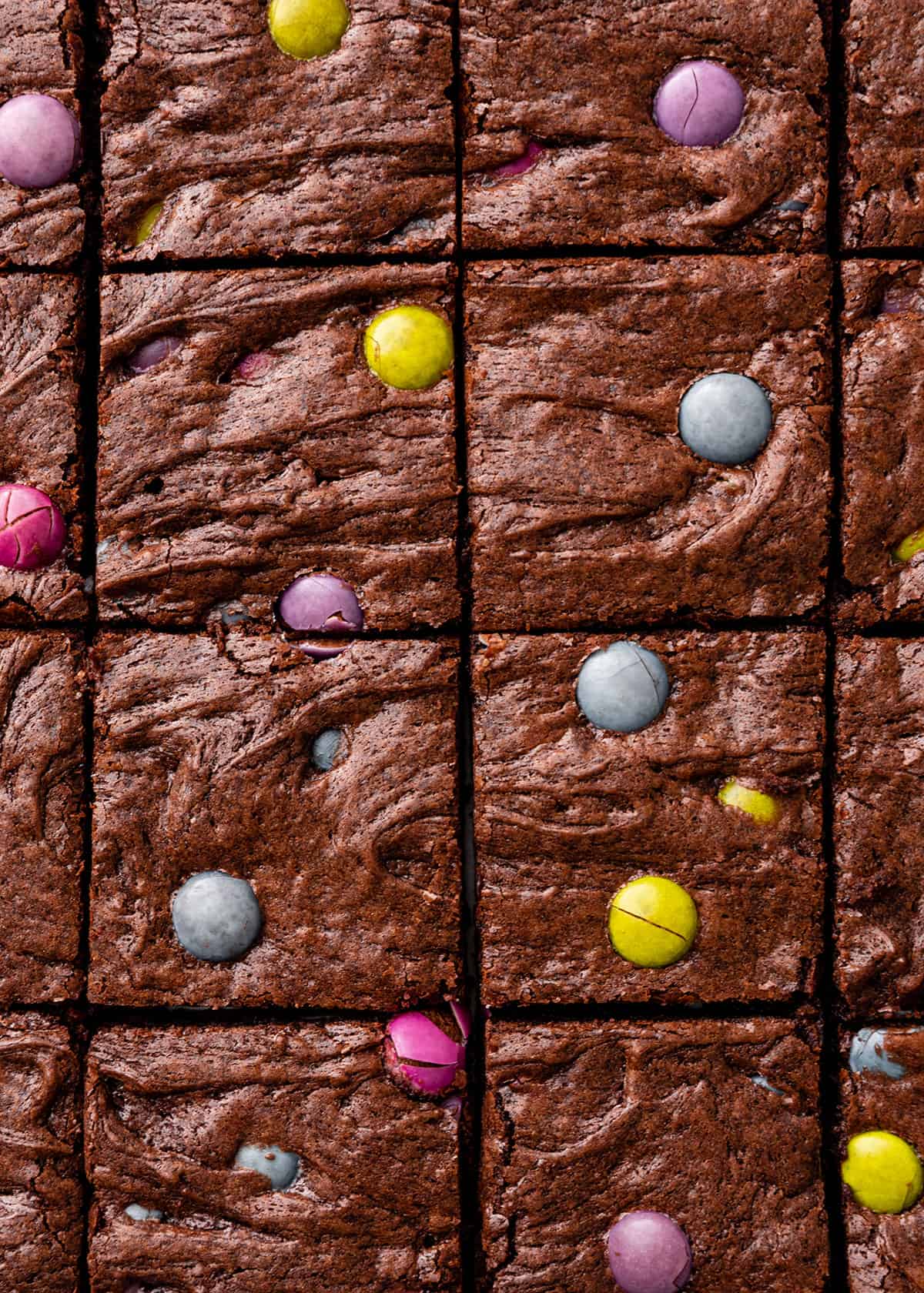 up close view of 16 M & M Brownies cut into squares