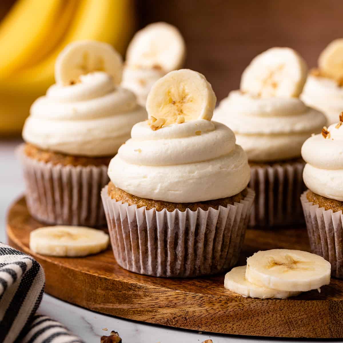6 Banana Cupcakes, frosted and topped with fresh bananas